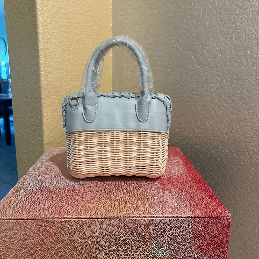 Elegant Woven Handbag with Blue Accents
